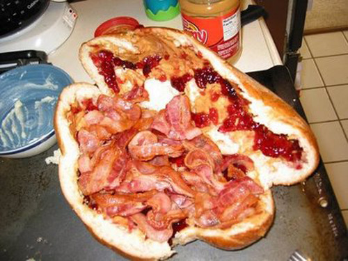 Fool’s Gold Loaf Sandwich A loaf of hollowed out bread filled with creamy peanut butter, a jar of grape jelly, and a pound of bacon. (Submitted by Nkg via wikipedia)